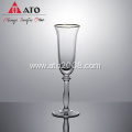 Gold rimmed crystal champagne flutes